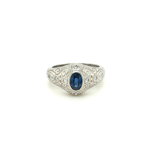 14kt White Gold Bezel Set Oval Sapphire Ring w/ Flush Set Diamonds