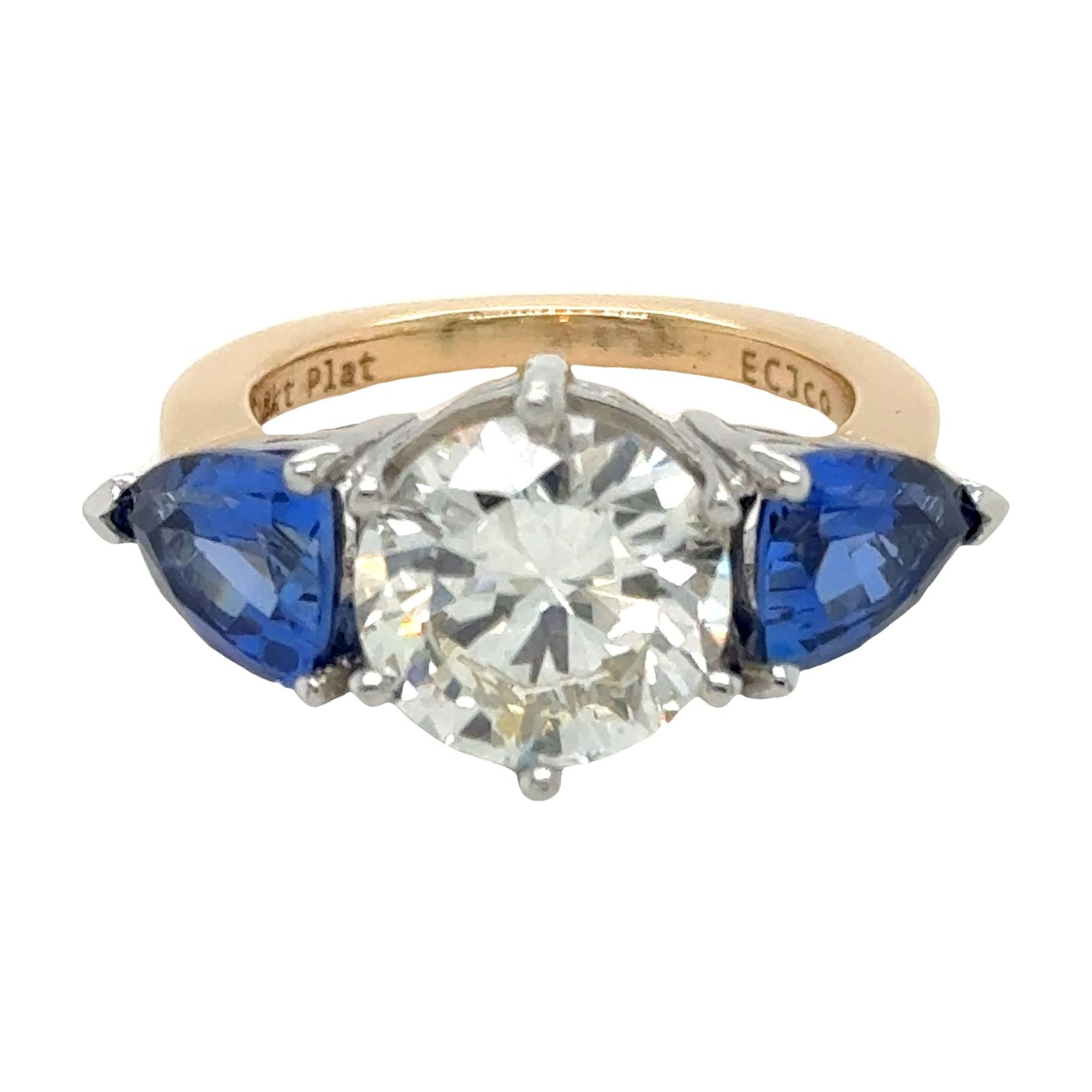 Diamond ring with blue side stones